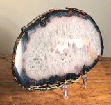 Beautiful Agate Slab. Large clear crystal center framed in blacks.  Agates have a stabilizing and strengthening influences which can help you build a lasting connection or resonance with which ever energy pattern a particular variety represents.