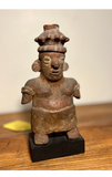 Strange Imports.  Pre-Columbian Art. Nayarit Polychrome Pottery Seated figure of a squat, compressed form with rich polychrome finish intact. Circa 100 B.C. - 250 A.D. From the estate of a Manhattan collector, originally purchased from Essex Arts in Manhattan, 1966