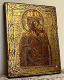 Strange Imports 
Blessed Virgin Mary and Child
Antique Icon Painting 
Russian Orthodox 
Early 19th Century.

Egg Tempera and Gilt on Wood Panel
7” tall x 5.5” wide x .5” thick

Brilliant shining gold with ornately carved and painted border with blue and red detailing. 
Condition is commensurate with age.