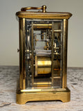 AIGUILLES BRASS AND BEVELED GLASS CARRIAGE CLOCK, FRANCE, LATE 19TH CENTURY