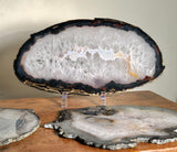 Beautiful Agate Slab. Large clear crystal center framed in blacks.  Agates have a stabilizing and strengthening influences which can help you build a lasting connection or resonance with which ever energy pattern a particular variety represents.