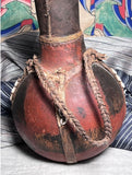 Strange Imports African Art Leather banded water Gourd  Maasai culture  Kenya Circa 1980’s  Vintage water gourd bottle with beautiful beadwork and leather fittings.