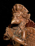 Antique Bronze Image of Garuda. Paten, Nepal. Mid 20th Century.  In Hinduism, Garuda is a divine eagle-like sun bird and the king of birds. He is described to be the vehicle mount of the Hindu god Vishnu. The Shatapatha Brahmana embedded inside the Yajurveda text mentions Garuda as the personification of courage.  He is a powerful creature in the epics, whose wing flapping can stop the spinning of heaven, earth and hell.