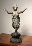 Bronze statue of a Thai Thepphanom Temple Guard Dhyana Dance.  Circa 1970 Thailand.  16” tall x 10” wide x 5” deep.  Teppanom are a mythological angel and part of the Buddhist tradition in Thailand. They first came to earth when Buddha reached enlightenment and became Buddha’s protector, then guardian of religious temples, and are seen as protectors of the house and land of the owner. 