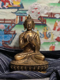Bronze Buddha Dharmachakra mudra turning the wheel of dharma 