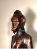 Vintage Fang Ancestor figure from Congo circa 1980s-1970s. The Fang belong to Gabon, Cameroon, the Congo and Equatorial Guinea. Fang figures boast elongated features and rich dark patina. Hand carved from a single block of wood.