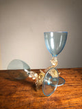 Strange Imports - A beautiful pair of blue and gold Venetian Dolphin Goblets.  Handblown Glass. Island of Murano. Salviati Studio. Circa 1960.  Aquamarine Glass with 24 Karat Gold Dolphins.  6.5” tall x 3" diameter  excellent condition   