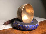 Strange Imports Carbondale Colorado Antique Thadobati Singing Bowl from Nepal. Easy to play, rich sound, extraordinary resonance, comfortable in the hand.   Antique Singing Bowls produce harmonic overtones unique only to bowls that are hand hammered.