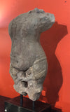 Stone sculpture of a deity . Architectural fragment