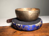 Strange Imports Carbondale Colorado Antique Thadobati Singing Bowl from Nepal. Easy to play, rich sound, extraordinary resonance, comfortable in the hand.   Antique Singing Bowls produce harmonic overtones unique only to bowls that are hand hammered.