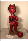 Strange Imports African Art Vintage Puni mother figure from Gabon , circa 1980s-1970s.  Carved from a single block of wood. Adorned with beaded necklace and anklet. Mother figure nursing her infant.  figure is 17” tall total height on stand 40”