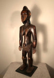 Vintage Fang Ancestor figure from Congo circa 1980s-1970s. The Fang belong to Gabon, Cameroon, the Congo and Equatorial Guinea. Fang figures boast elongated features and rich dark patina. Hand carved from a single block of wood.